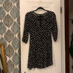 3-Quarter Length Sleeved Dress. Black w/ repeat bird pattern. Key hole bustline.